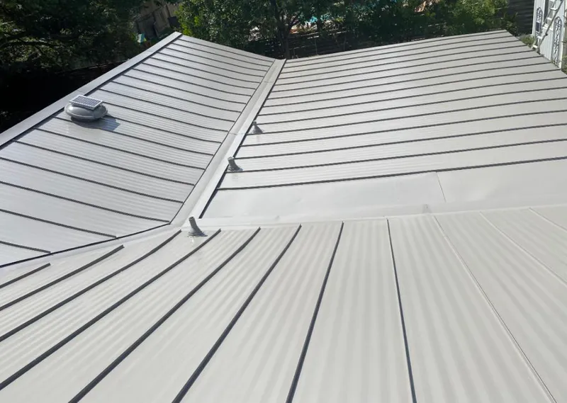 Solar attic fan installed on a metal roof for Roof Ventilation in Venice